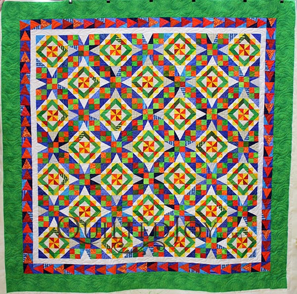 Jodi asked Angela Huffman to quilt her gorgeous Celtic Solstice quilt with a beautiful floral and feathery quilting design.