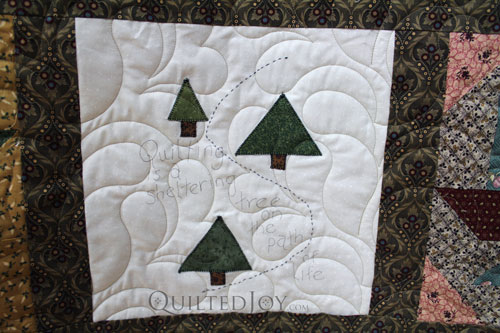 "Quilting is a Sheltering Tree on the Path of Life" on Nancy's Patchwork Sampler Quilt