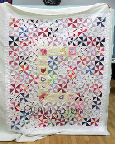 Baby Quilt with the Letter C and Baby Clothes