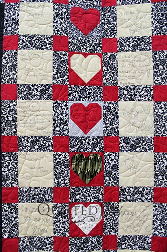 Wedding guests wrote notes and well wishes to the bride and groom on this signature wedding quilt