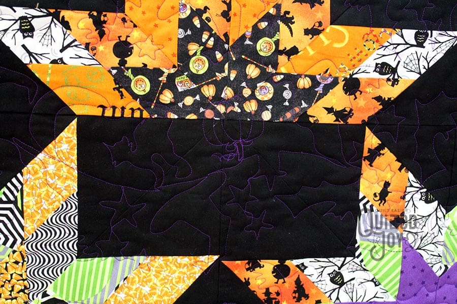 Polly's Halloween Lone Starburst Quilt after quilting it at Quilted Joy
