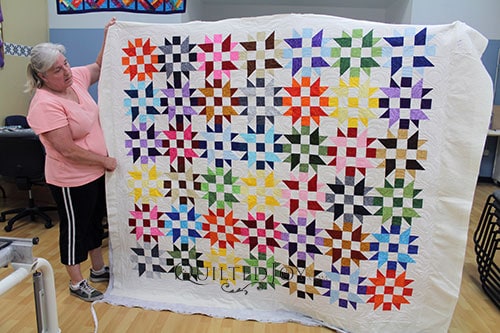Valerie's Bright Stars Quilt after renting a longarm quilting machine at Quilted Joy