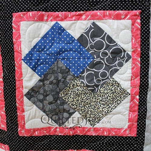 Barbara asked longarm quilter Angela Huffman to quilt her Card Trick Quilt