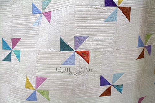 Starla's Pinwheel Quilt with free motion quilting and straight line quilting