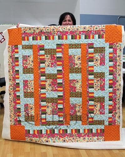 Danielle's Bright and Playful Quilt after her Longarm Quilting Machine Rental