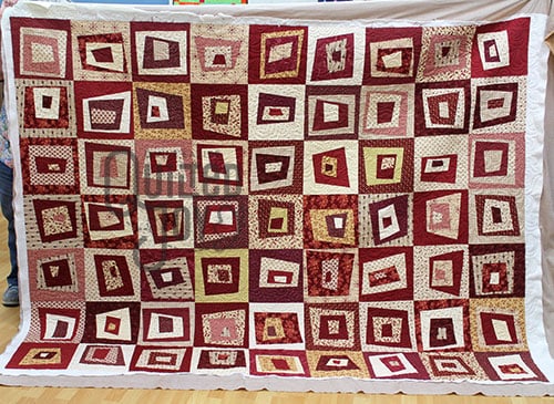 LuAnn's wonky squares quilt after renting a longarm machine at Quilted Joy