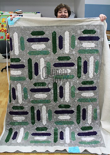 Pat quilted her Grunge Stripes Quilt on a longarm machine at Quilted Joy