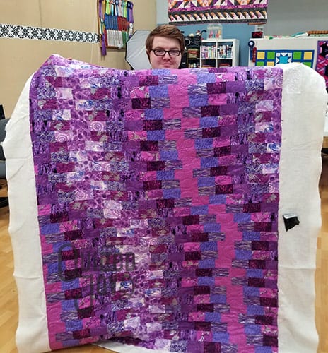 Dustin's purple quilt after quilting it at Quilted Joy