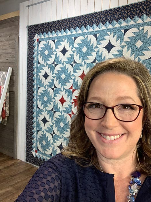 image of Angela Huffman with Blue Ridge Love Quilt in the background