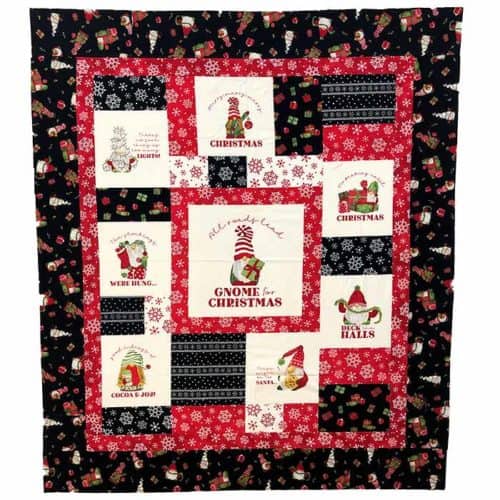 image of Gnome for Christmas Quilt, a flannel quilt with gnome, Christmas, and snowflake themed fabrics