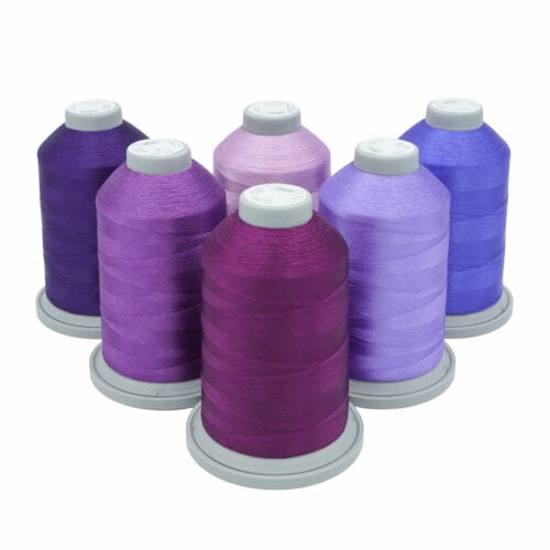 Glide Thread Color Block Bundle - Purple - six cones of purple Glide thread on a white background