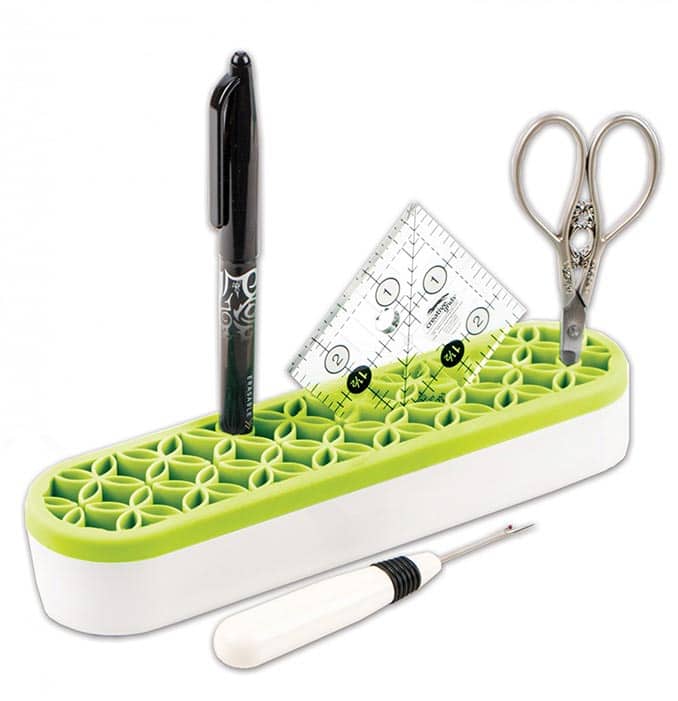 image of Oh Sew! Organized Stash 'n Store Lime with a pen, ruler, scissors, and seam ripper