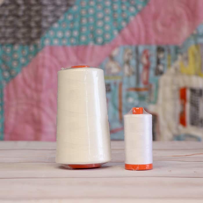 image of two cones of Aurifil white thread