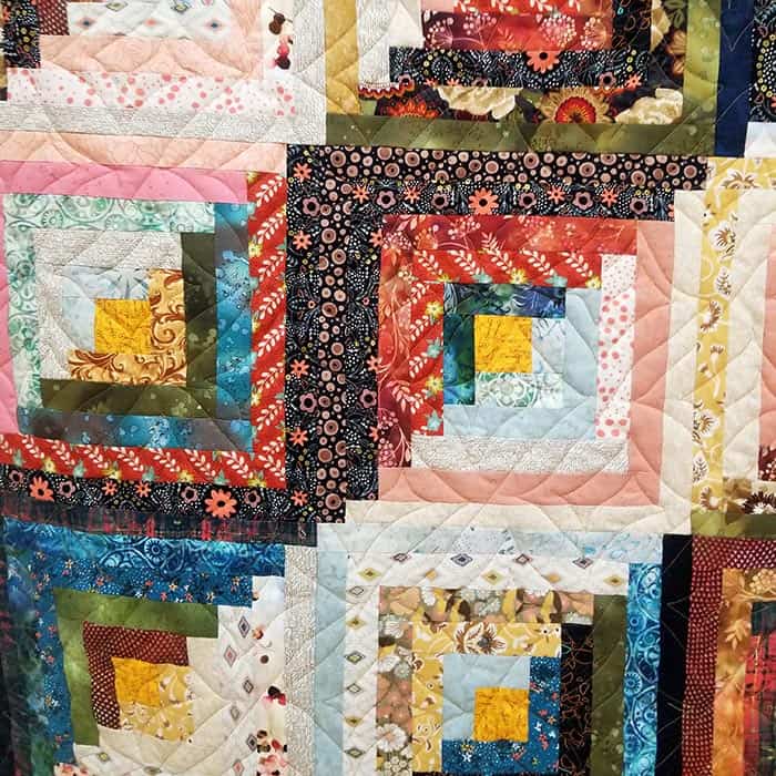 close up image of a log cabin quilt