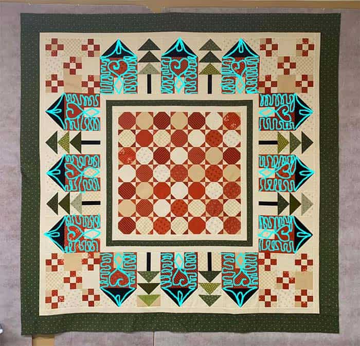 image of Tracey's Neighborhood of Houses Quilt, unquilted with quilting ideas drawn on the image