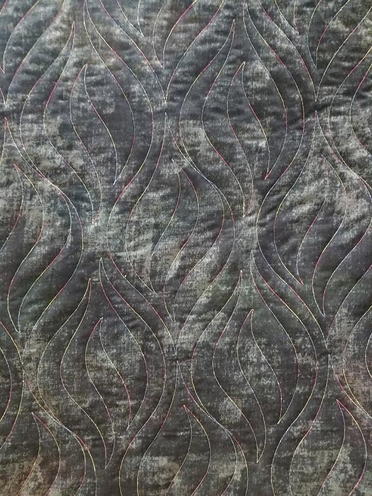 image of quilt backing fabric with Onion Skin pantograph quilting